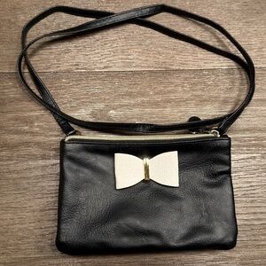 Like New Black Crossbody Bag with White Bow Detail